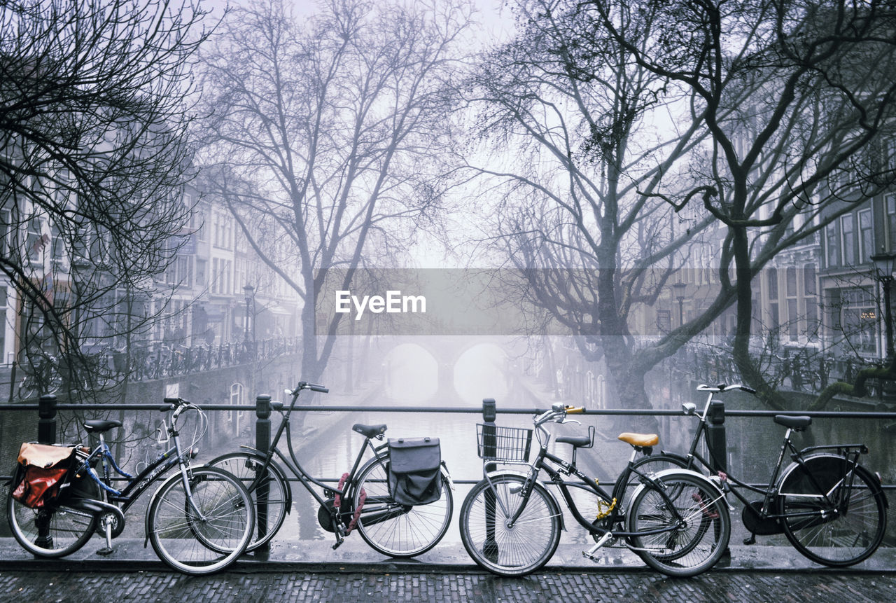 BICYCLES PARKED ON SNOW COVERED CITY