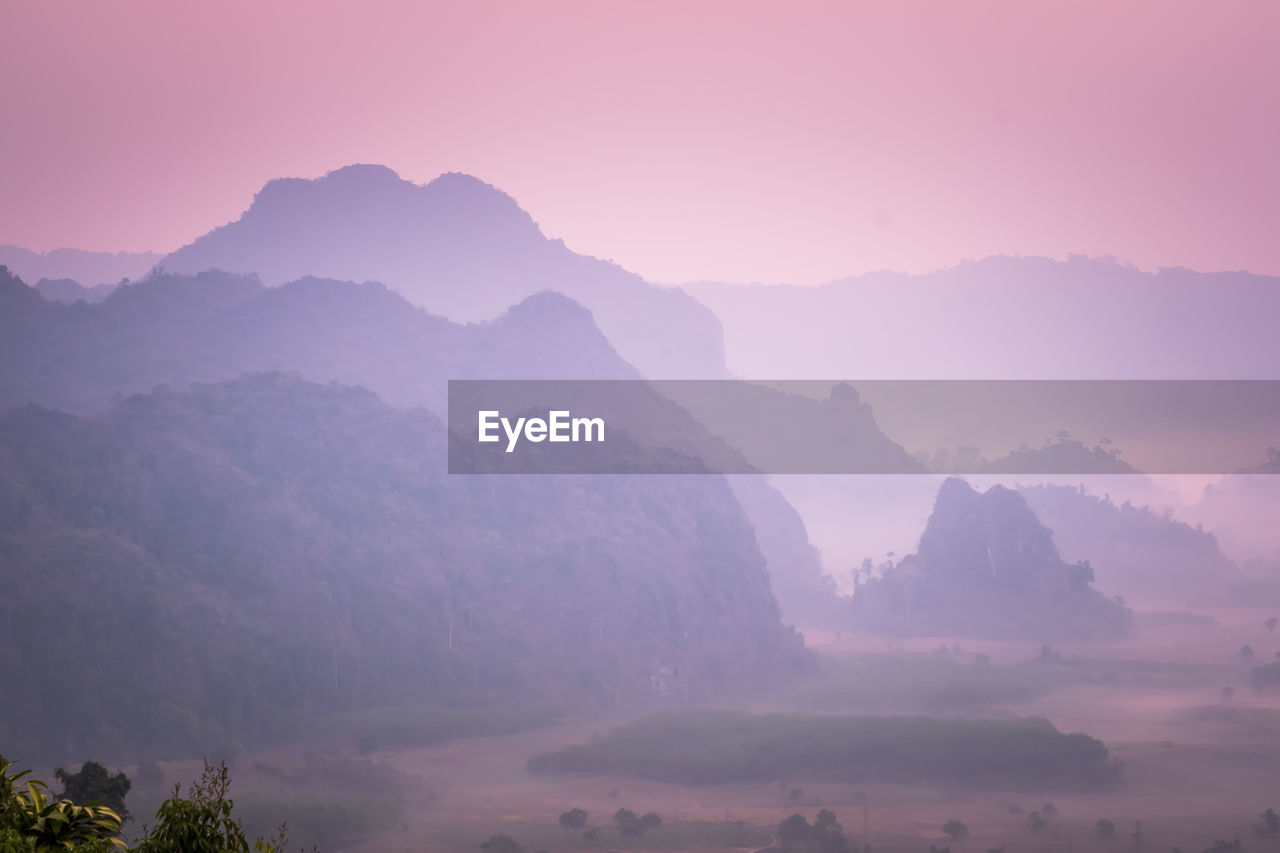 Scenic view of mountains against sky during sunset