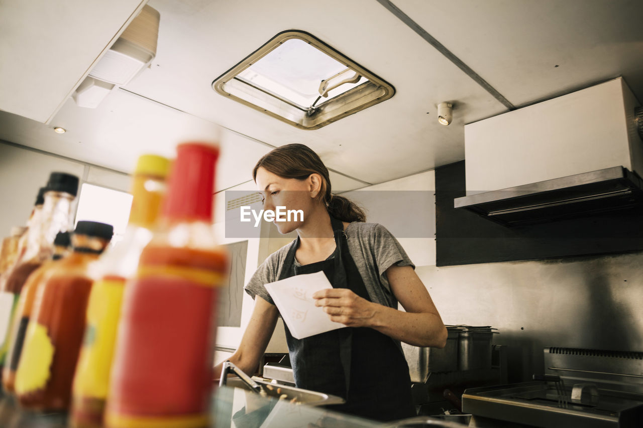 Female chef working in food truck