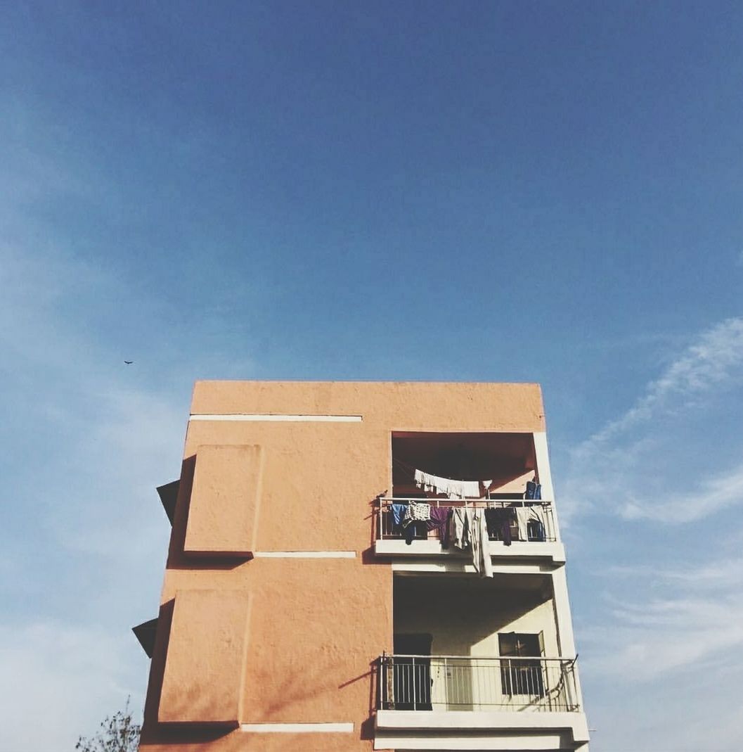 LOW ANGLE VIEW OF BUILT STRUCTURE AGAINST THE SKY