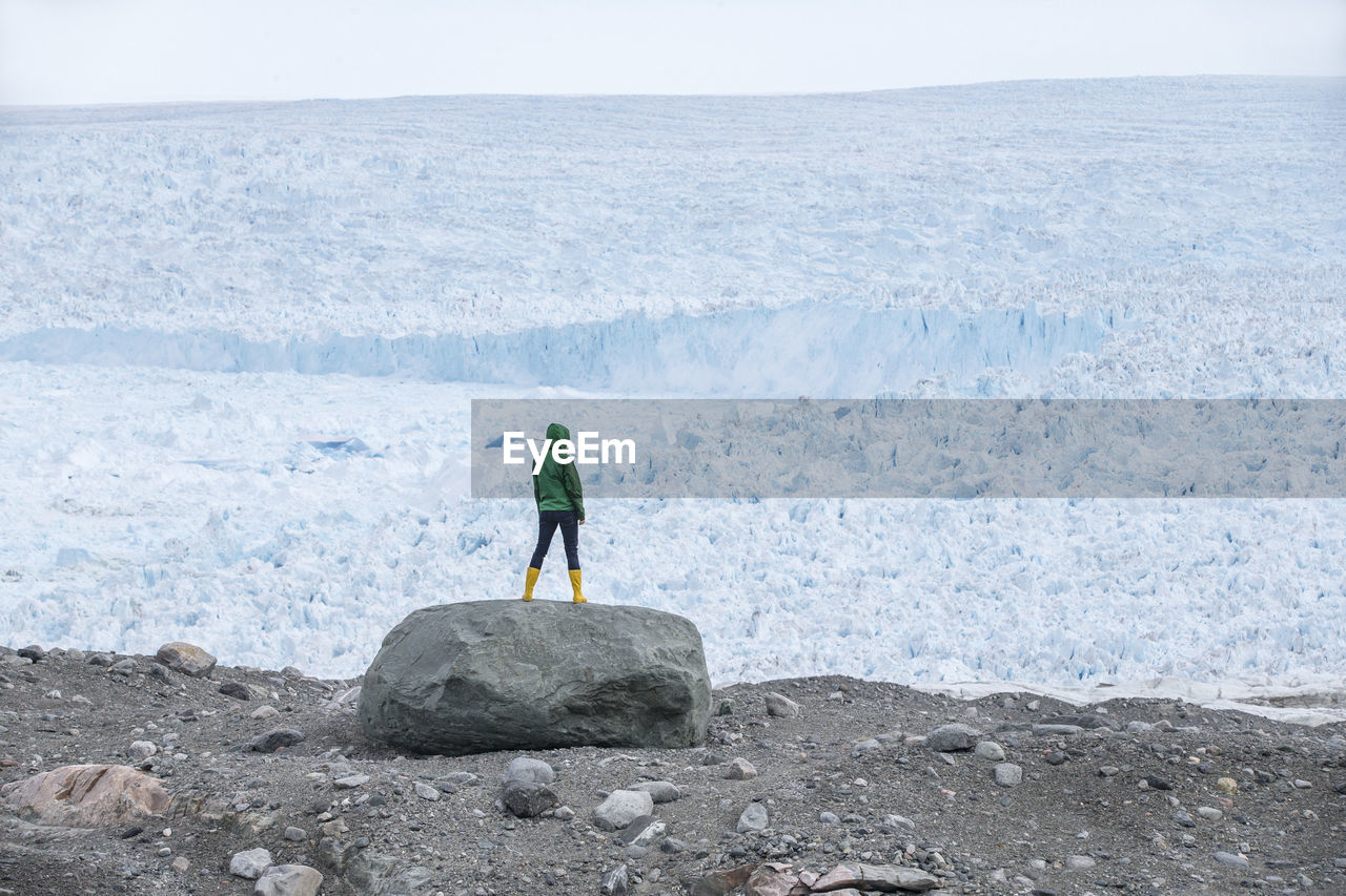 Woman looking at glacier