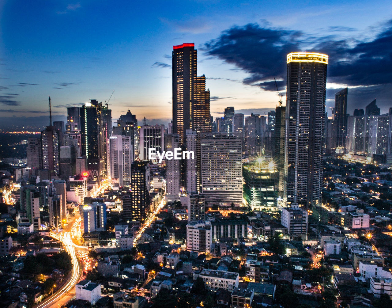 Aerial view of city lit up at night