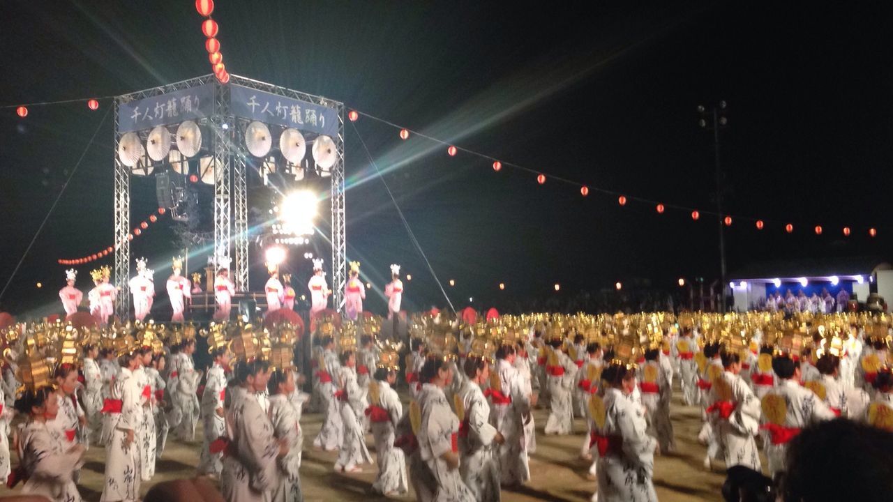 Large group of people in front of stage