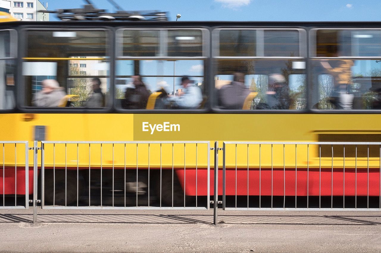 Blurred motion of cable car on street