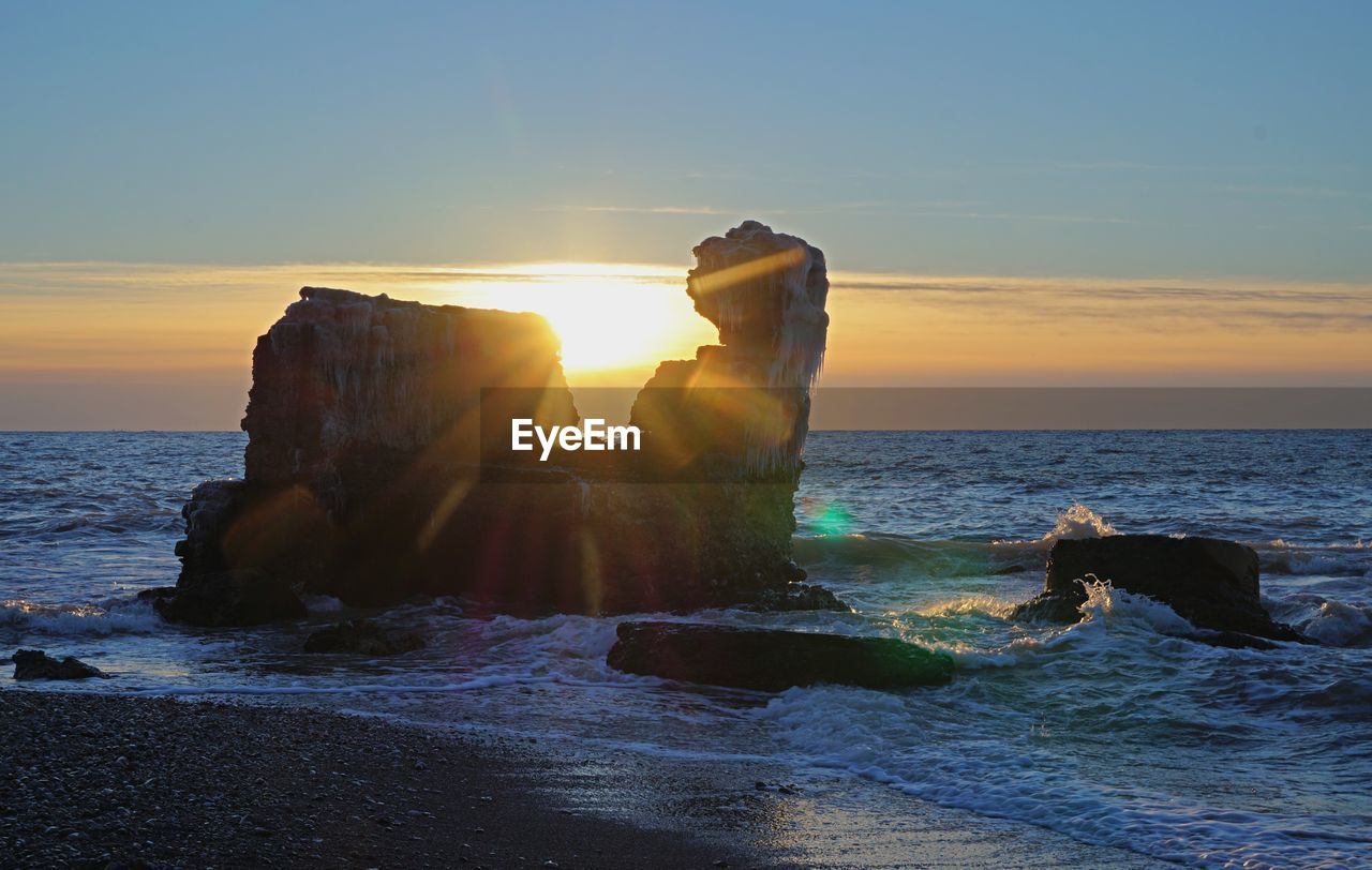 Scenic view of sea against sky during sunset