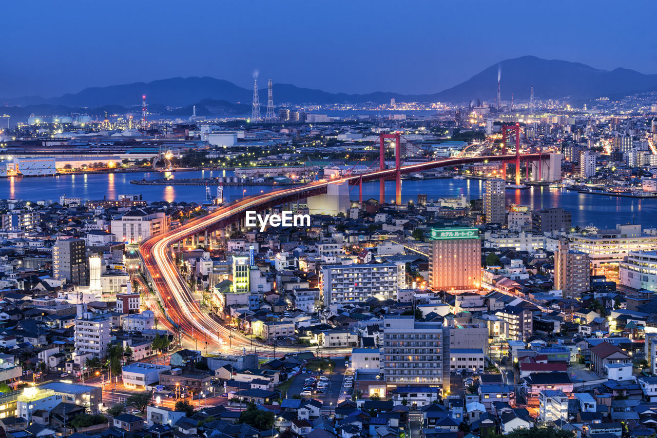 High angle view of illuminated buildings in city at night