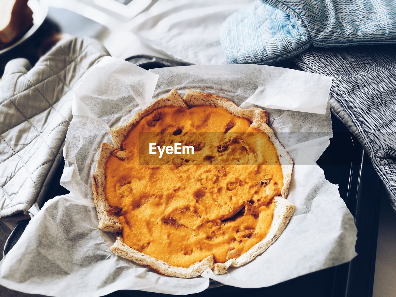 High angle view of pumpkin pie in container on table