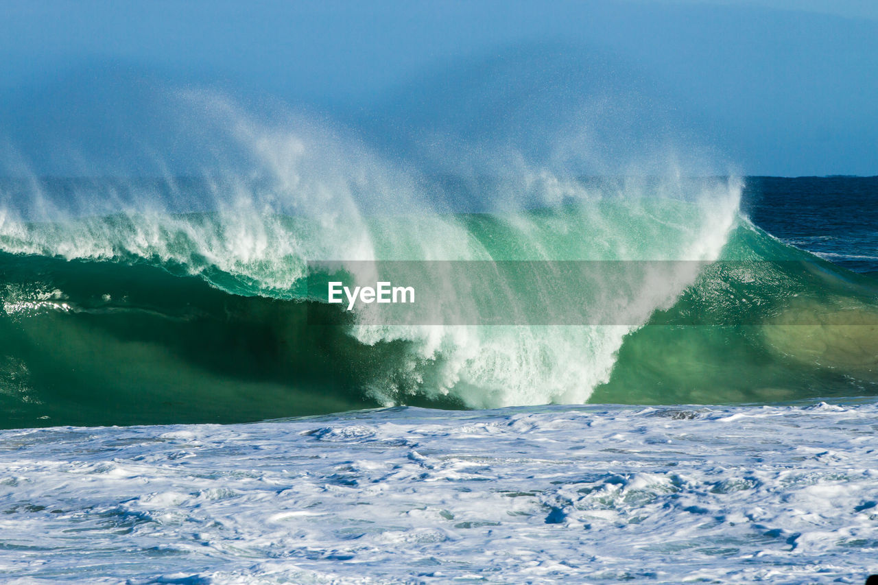 Scenic view of sea waves rushing towards shore