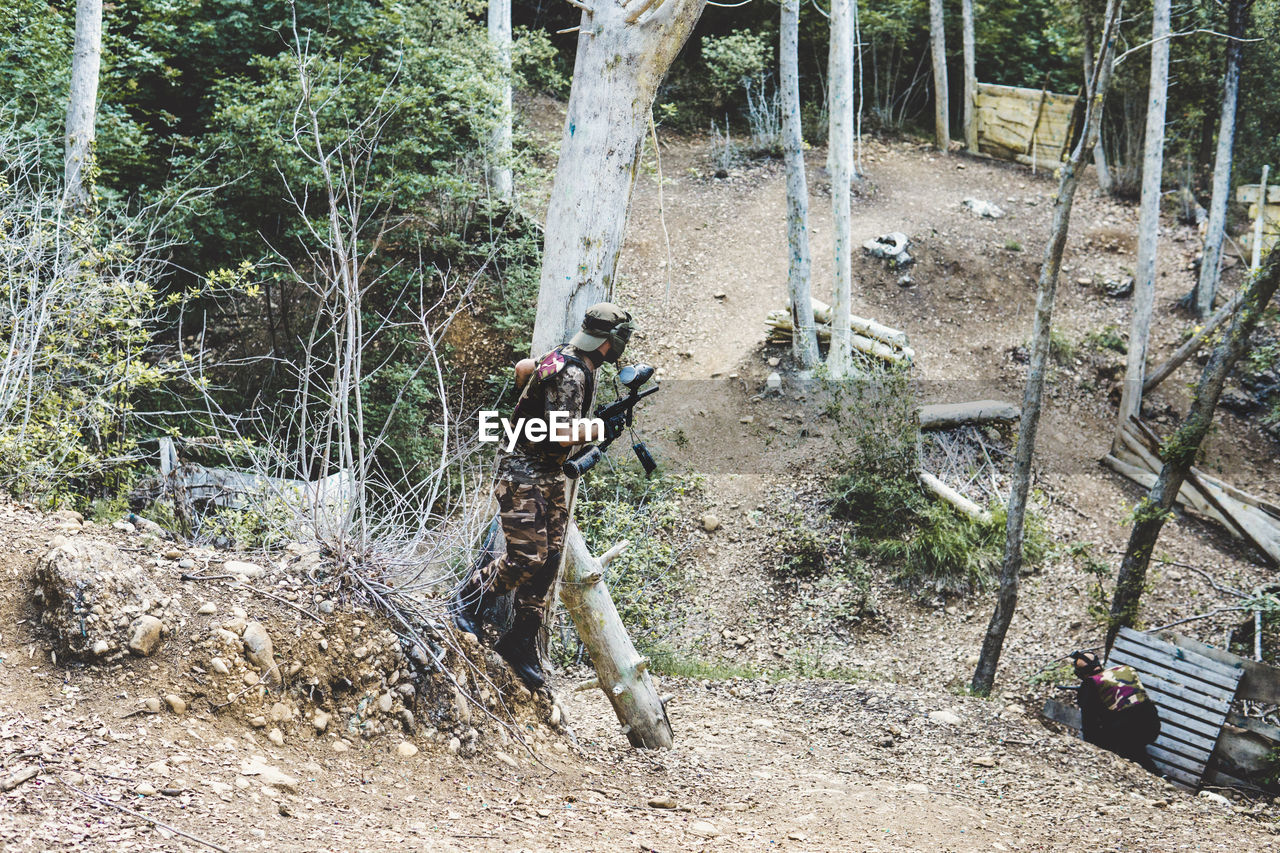 High angle view of army soldiers training in forest