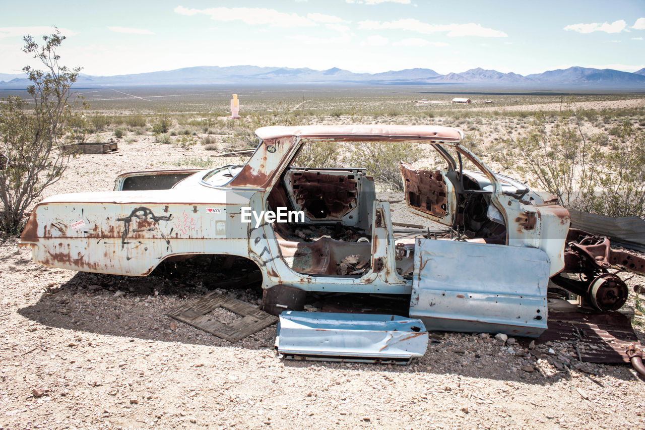 Damaged car on field