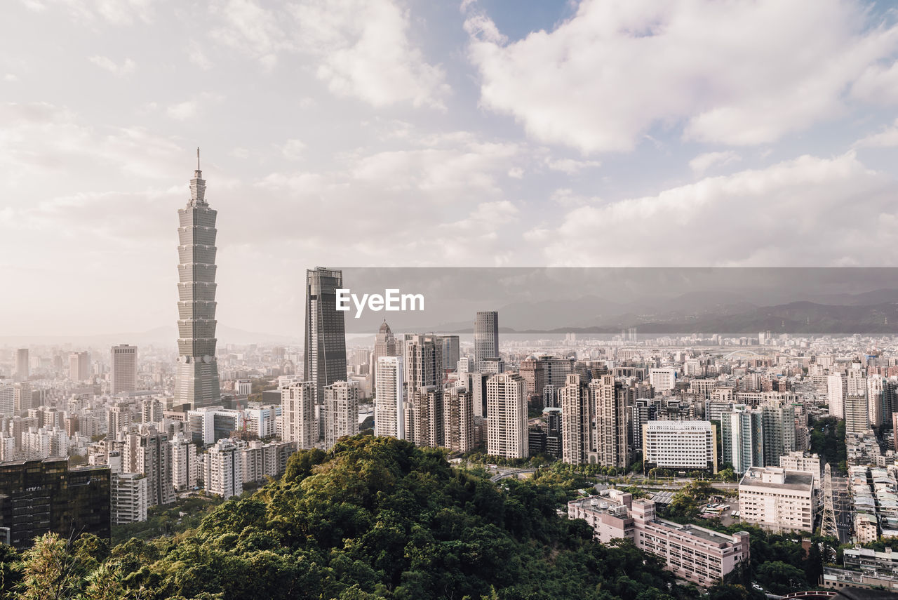 Modern buildings in city against sky