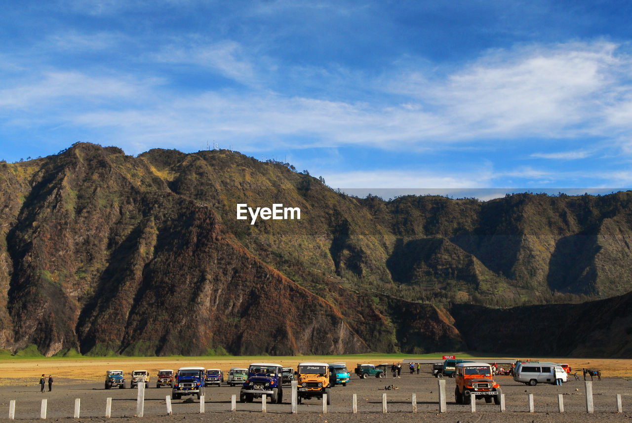 Scenic view of mountains against blue sky