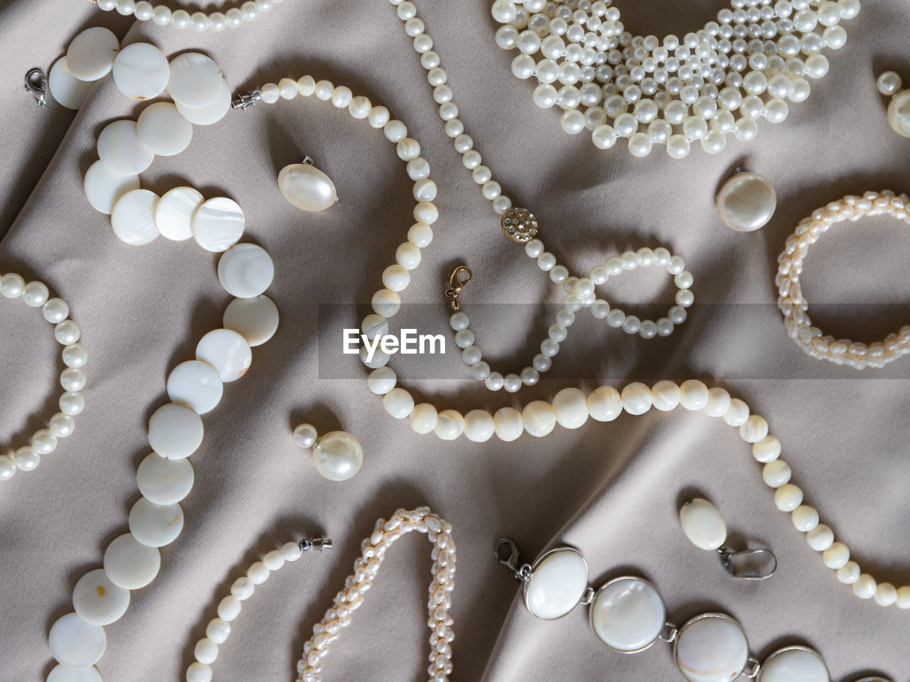 high angle view of pearl jewelry