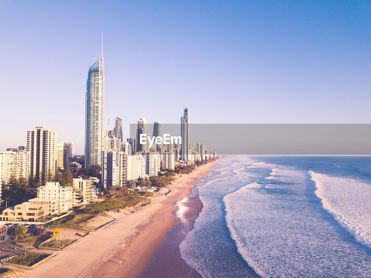 Panoramic view of beach with city in background