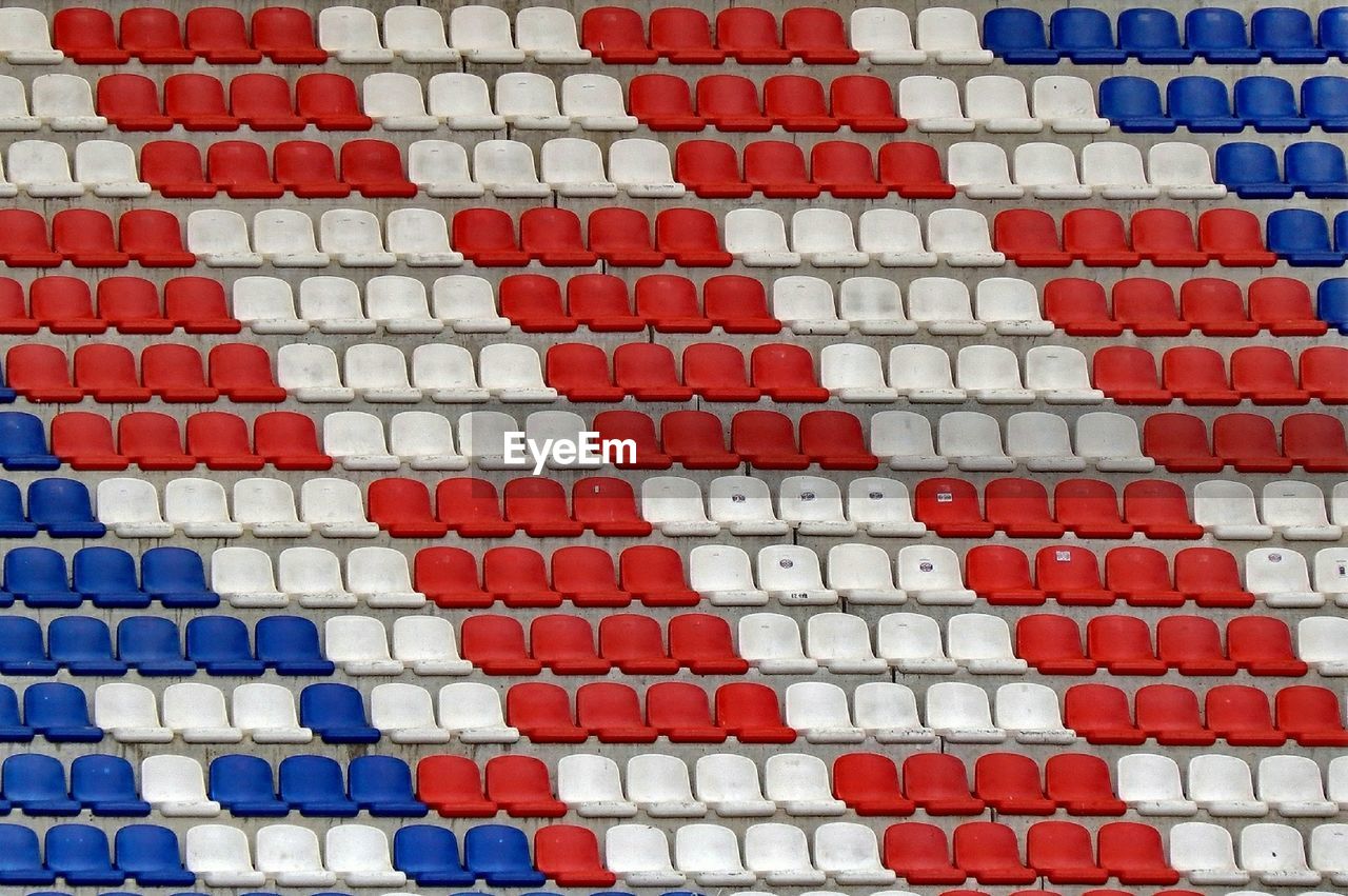 Full frame shot of empty chairs in stadium