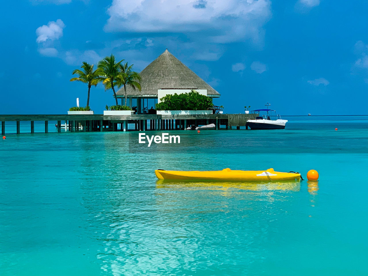 VIEW OF SWIMMING POOL BY SEA AGAINST SKY