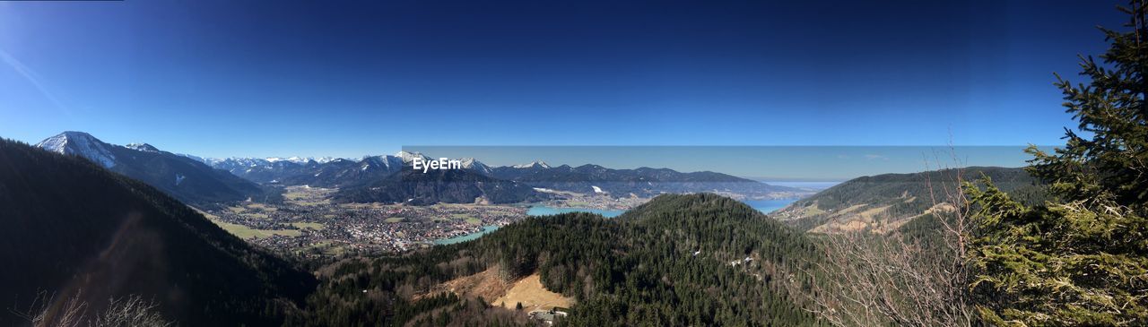 Panoramic view of landscape against clear blue sky