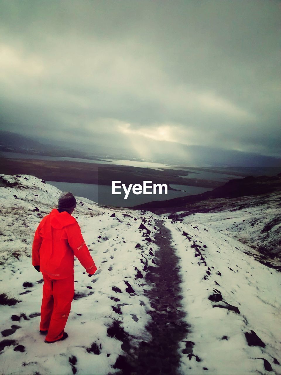 Person standing on snow covered landscape