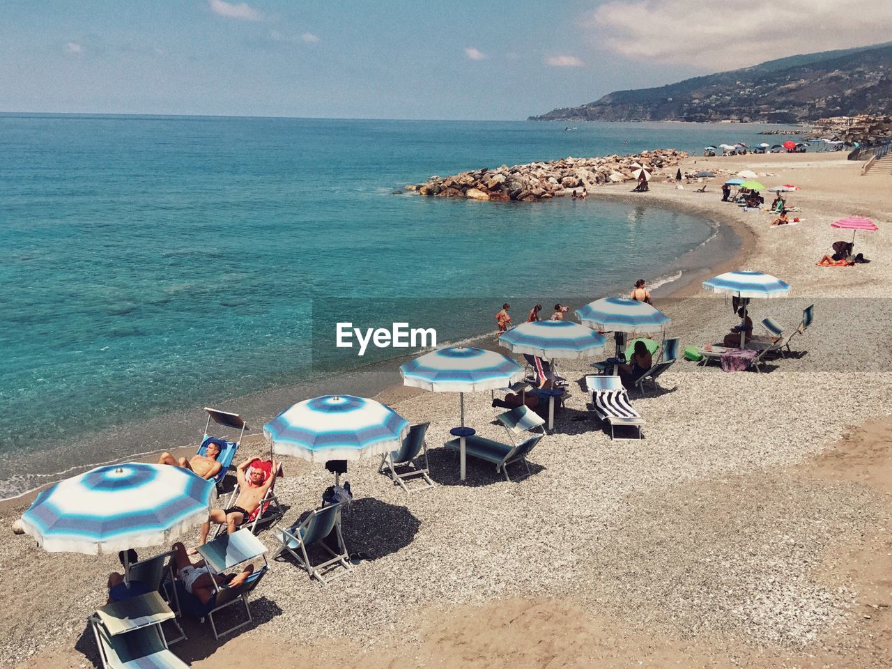 HIGH ANGLE VIEW OF PEOPLE AT BEACH