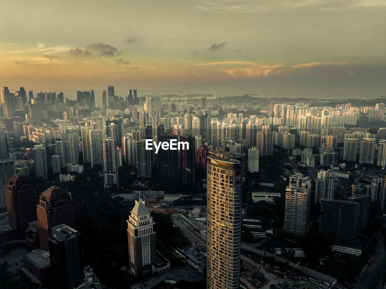 High angle view of modern buildings in city against sky