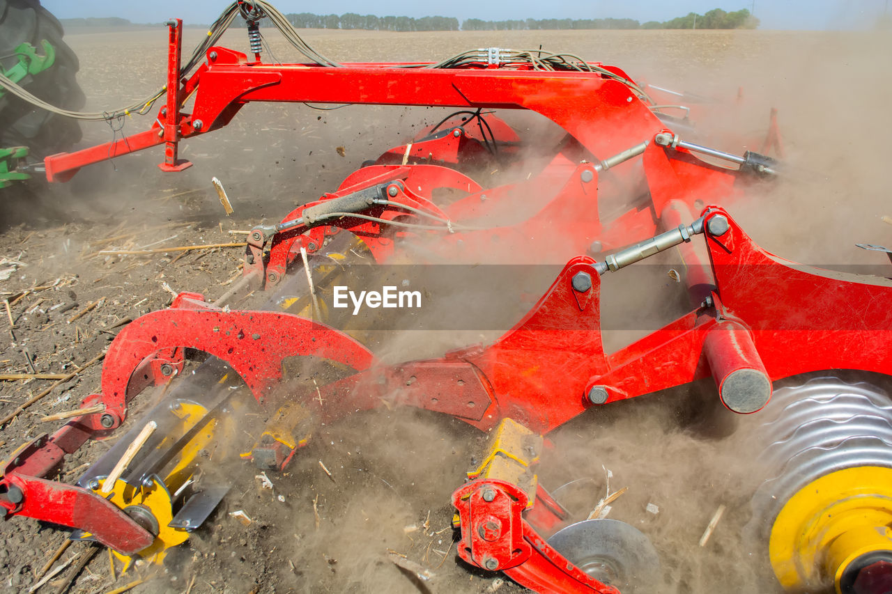 HIGH ANGLE VIEW OF CRANE AT CONSTRUCTION SITE BY WATER