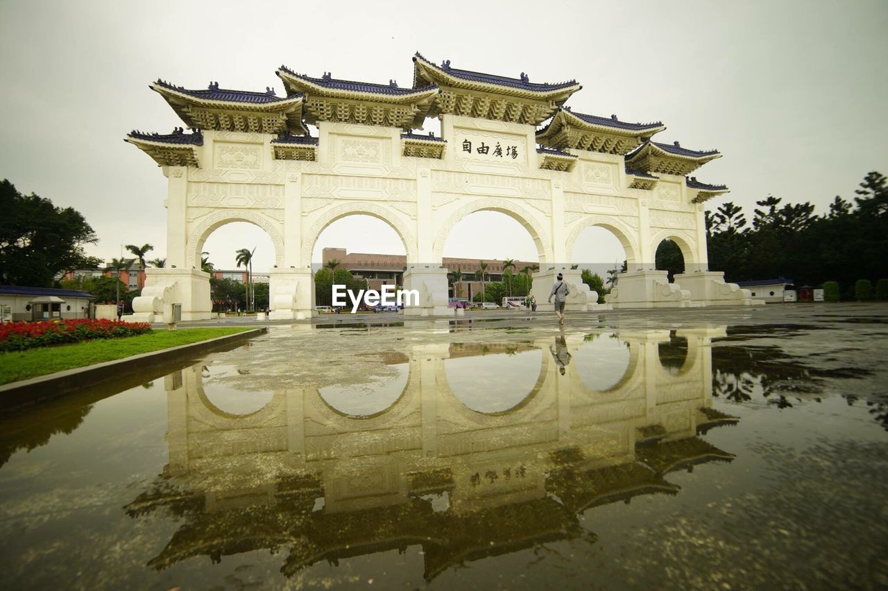 REFLECTION OF BUILDING IN WATER