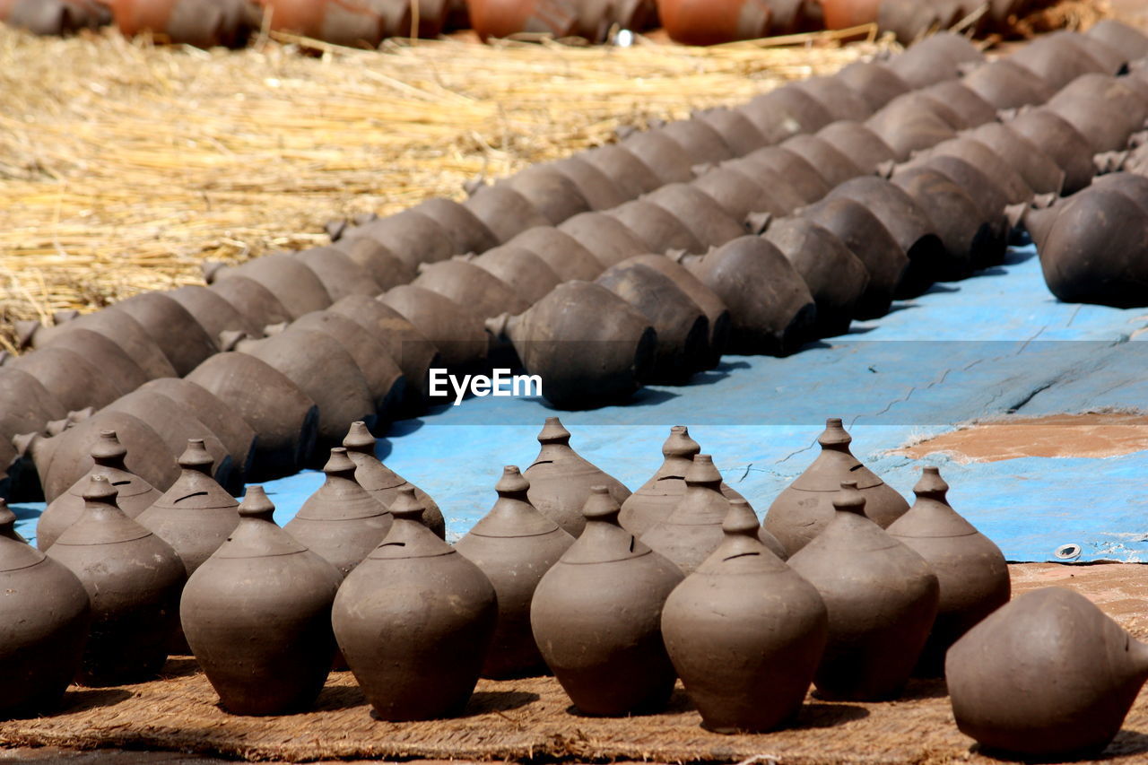 Clay piggybanks arranged outdoors