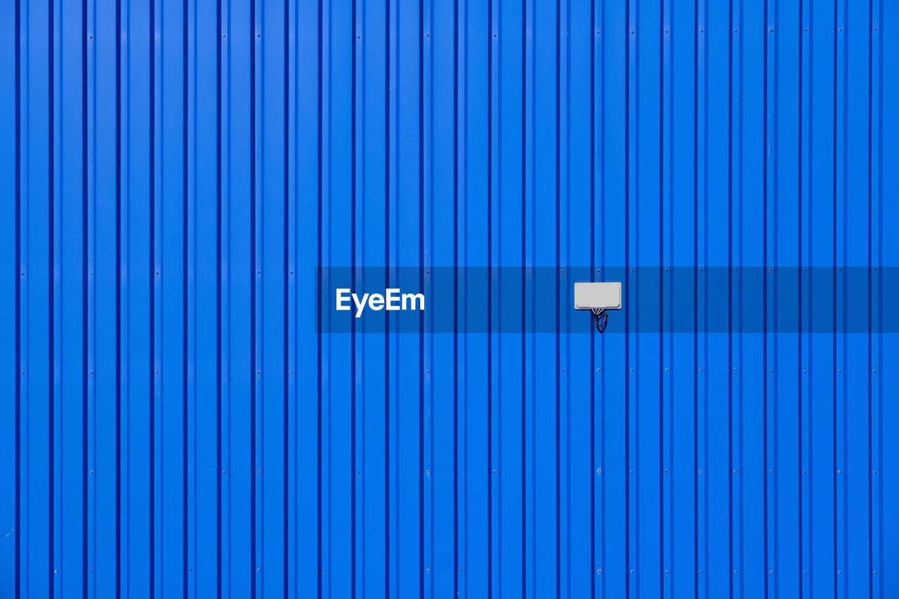 Full frame shot of blue metallic wall