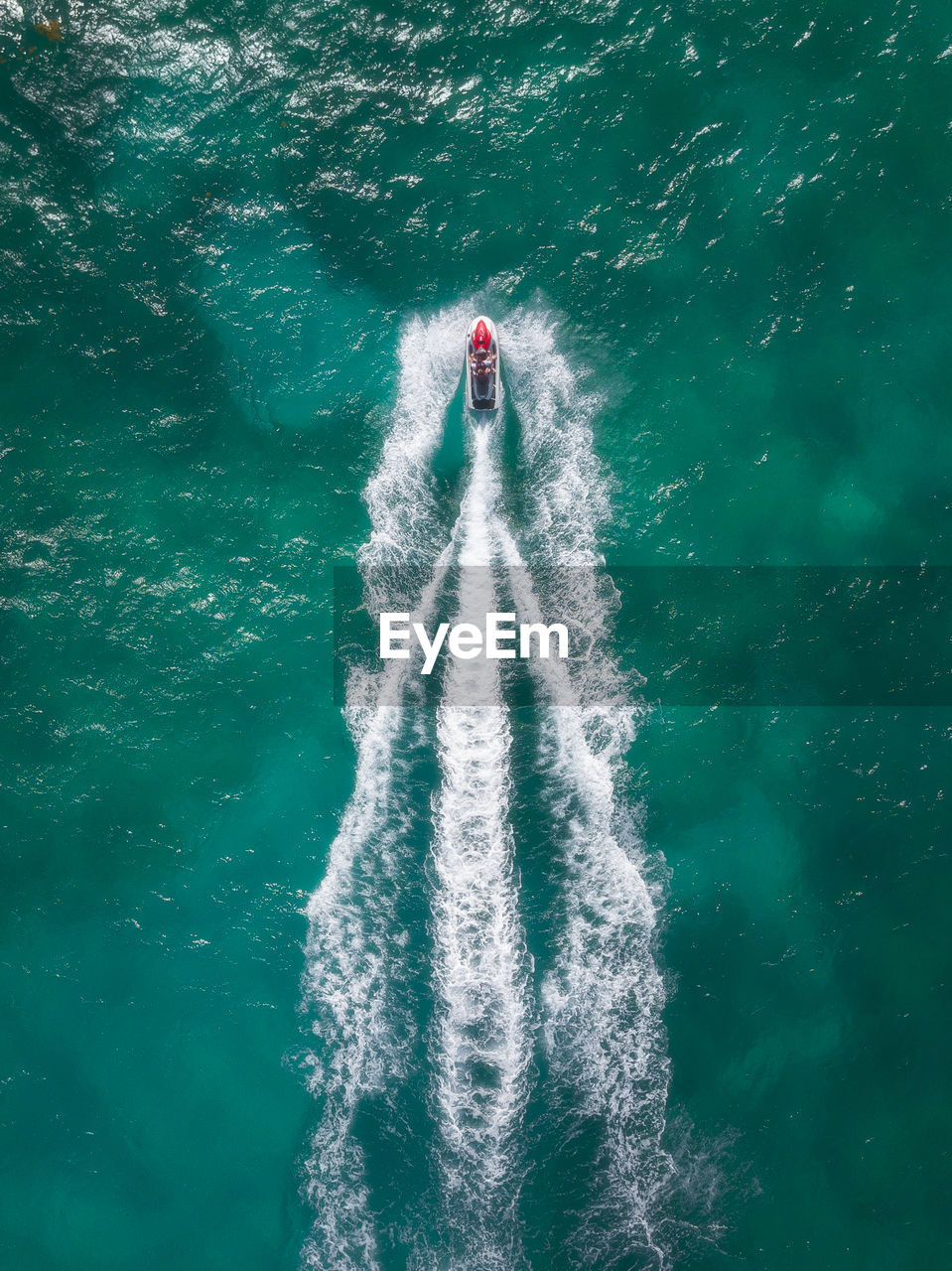 Aerial view of sailing in jet boat on sea