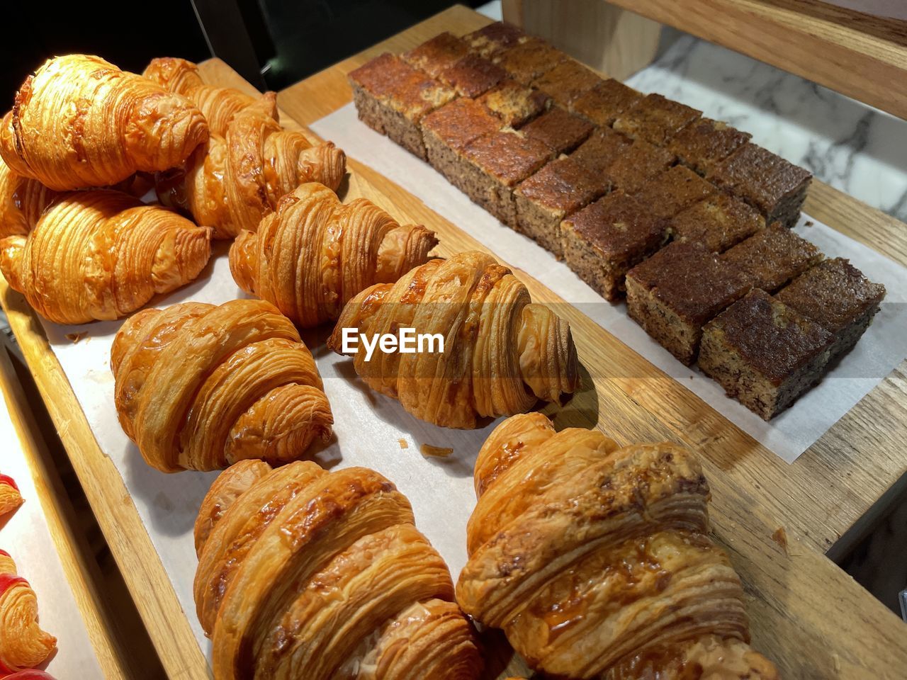 Close up group of fresh baked croissants, super delicious warm fresh buttery croissants and rolls