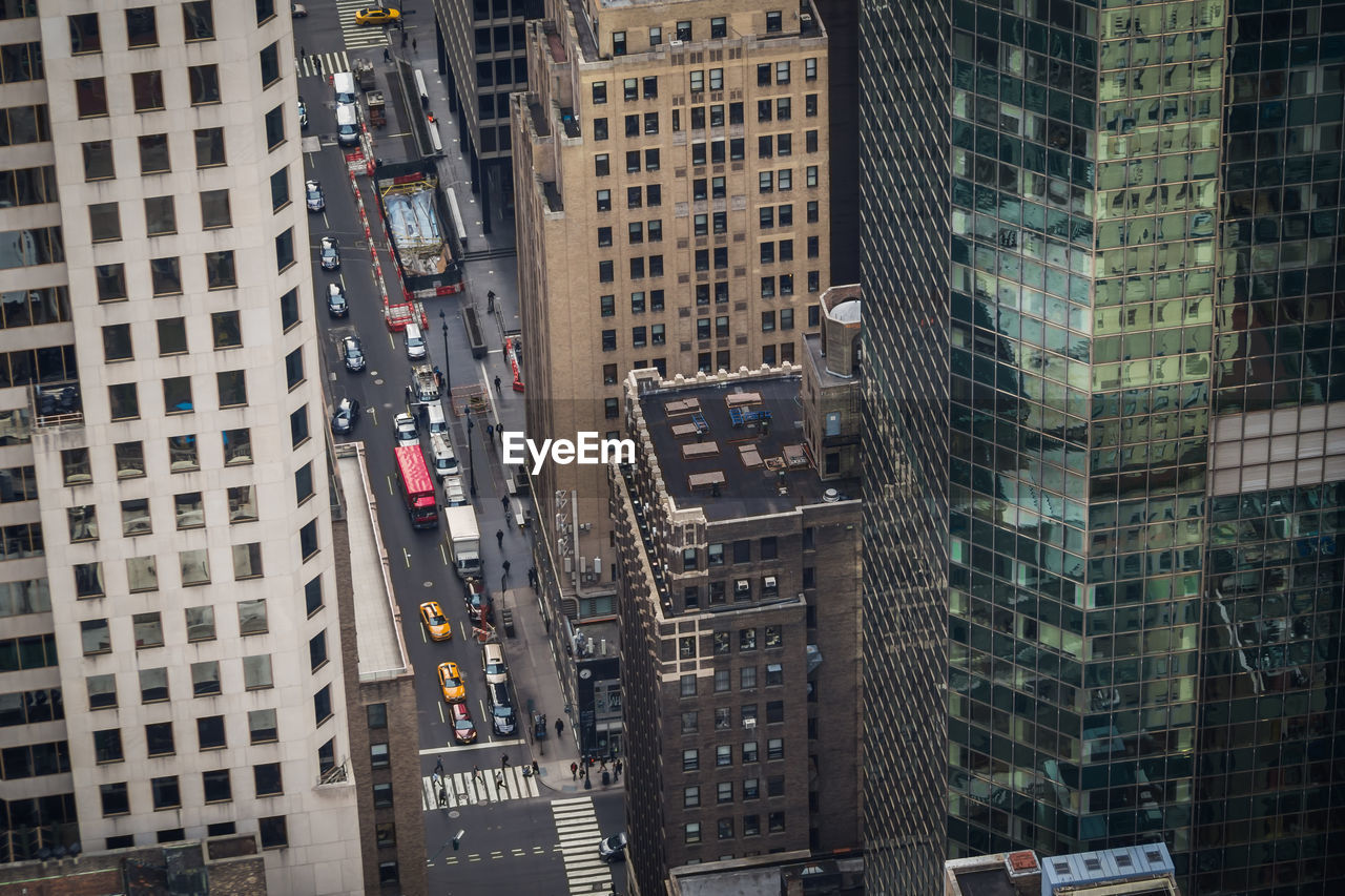 Aerial view of traffic on new york streets at the end of the day from a skyscraper through buildings