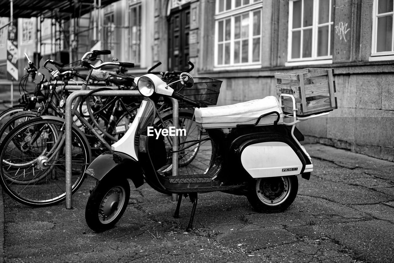 BICYCLE PARKED ON STREET BY FOOTPATH