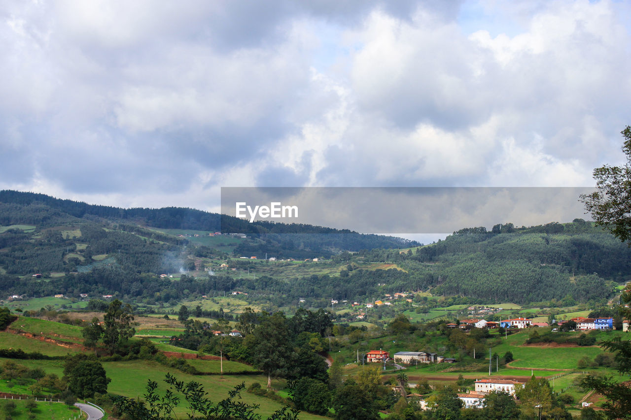 Scenic view of landscape against cloudy sky