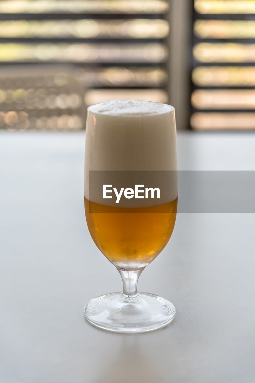 Close-up of beer in glass on table