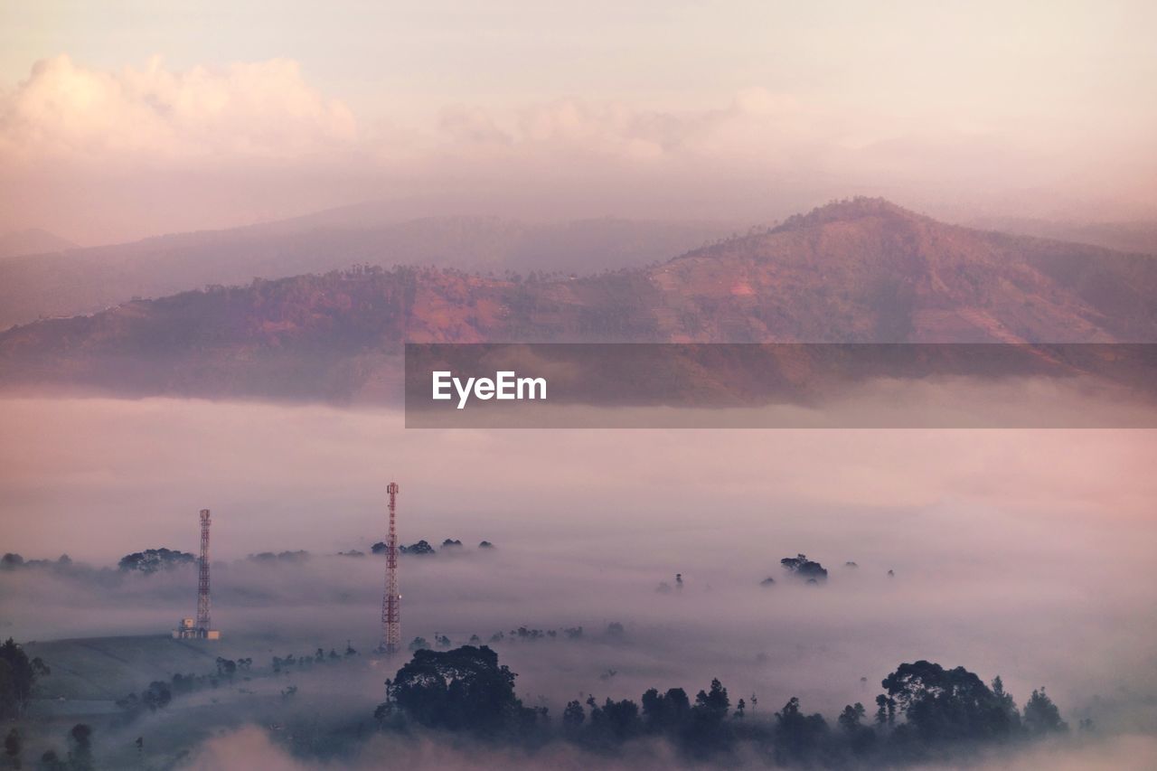 Scenic view of mountains against sky during sunset