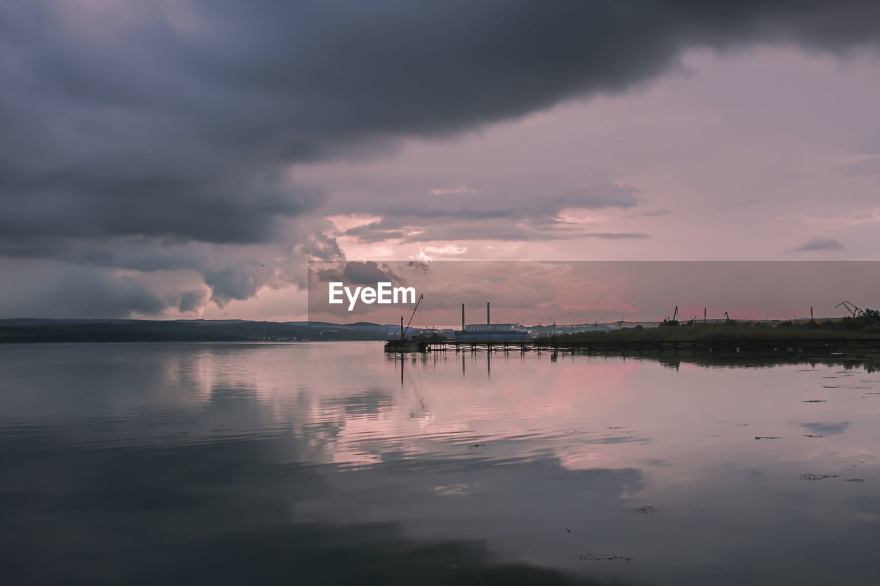 Scenic view of sea against sky at sunset