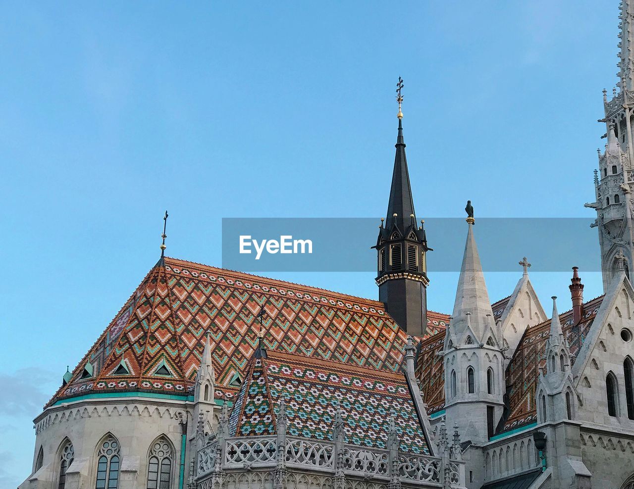 Low angle view of buildings against blue sky