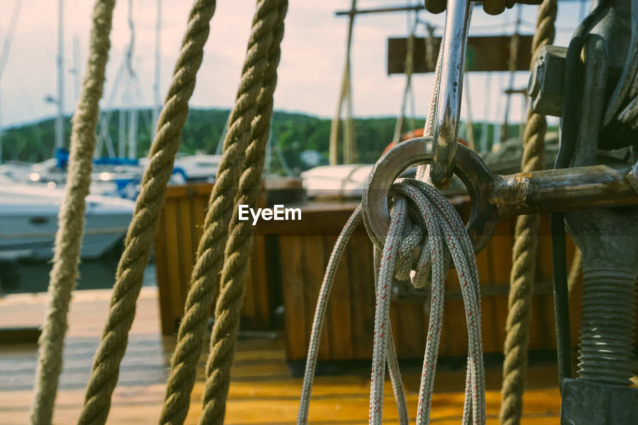 Close-up of ropes tied on metal