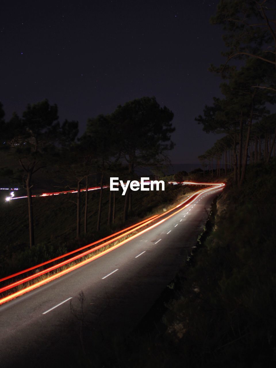 Light trails on road at night