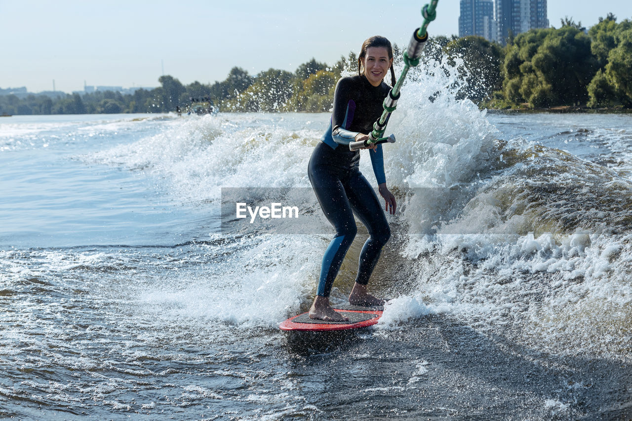 Woman wakesurfing in moskva river