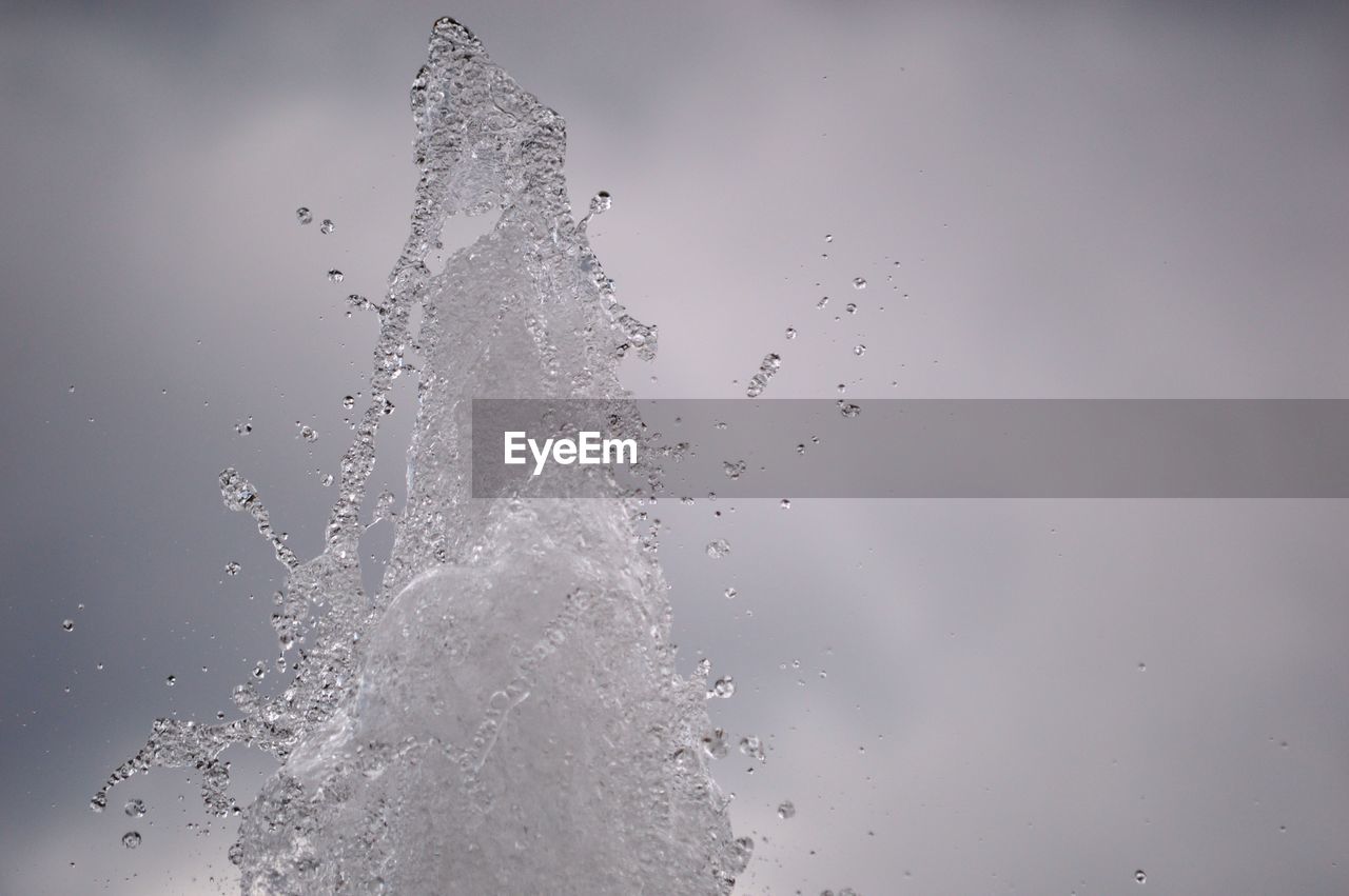 water, motion, splashing, freezing, drop, nature, studio shot, no people, macro photography, indoors, freshness, food and drink, gray background, branch, close-up, impact, sky, mid-air, falling