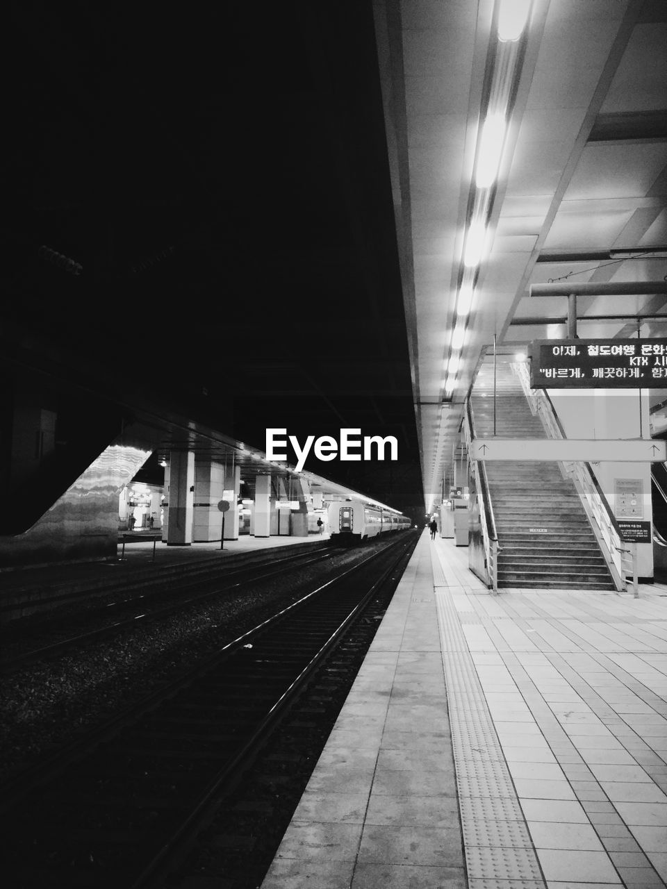 Railroad station platform at night