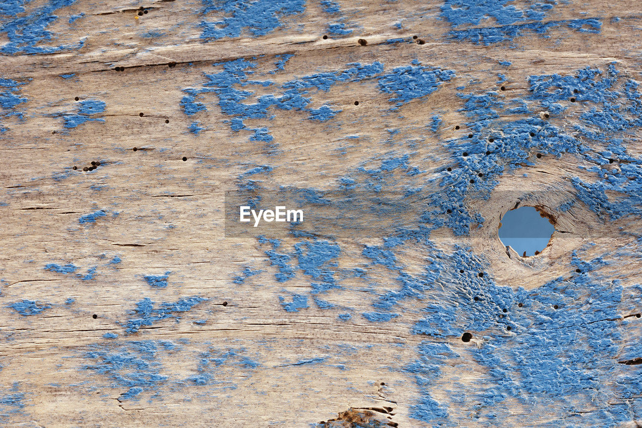 Old wood plank painted in blue , abstract background