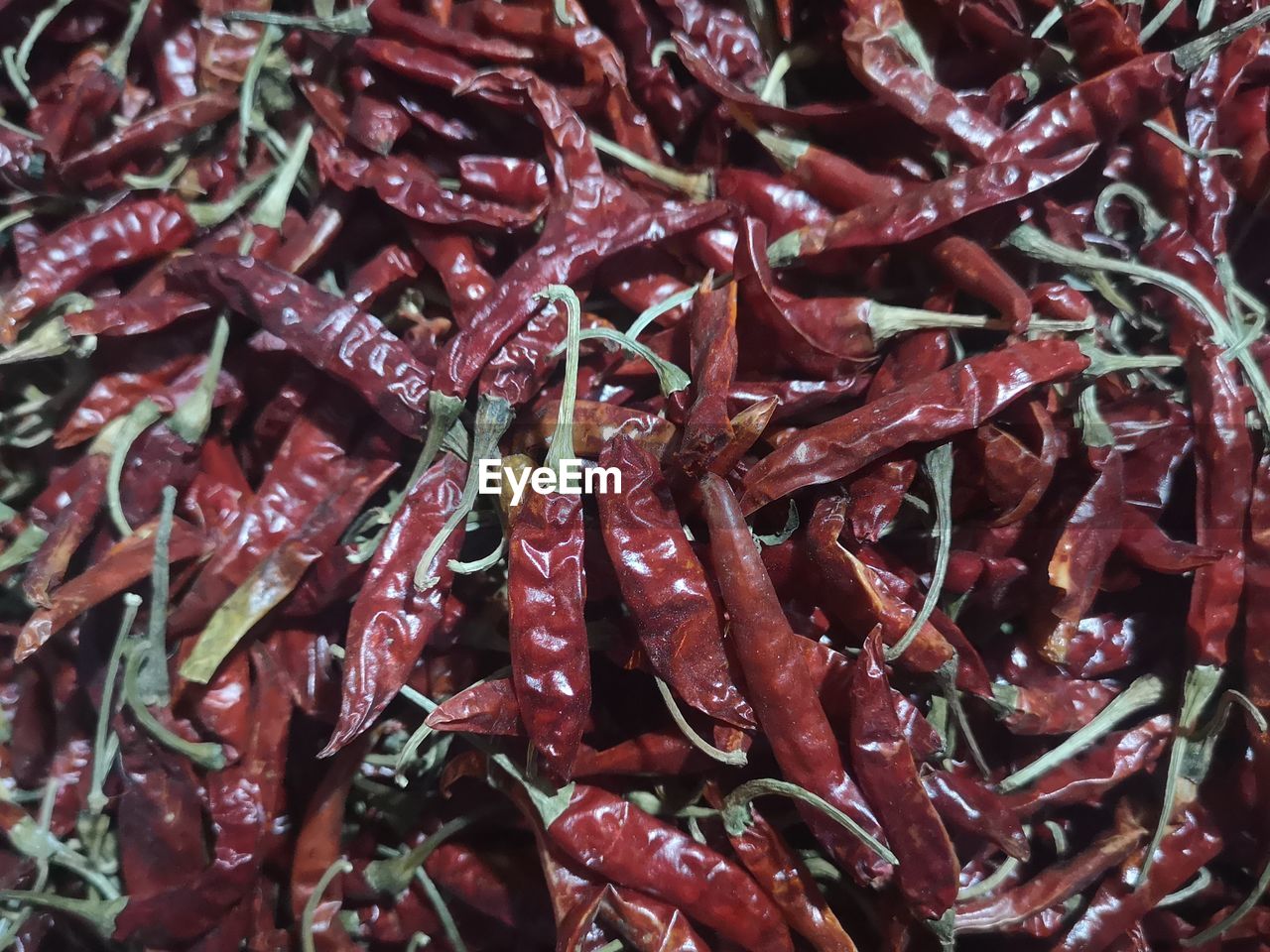 FULL FRAME SHOT OF RED CHILI PEPPERS FOR SALE AT MARKET STALL