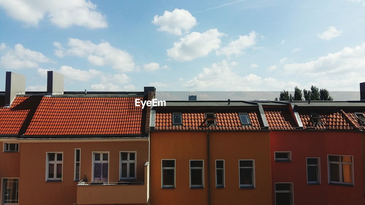 Houses against sky in city