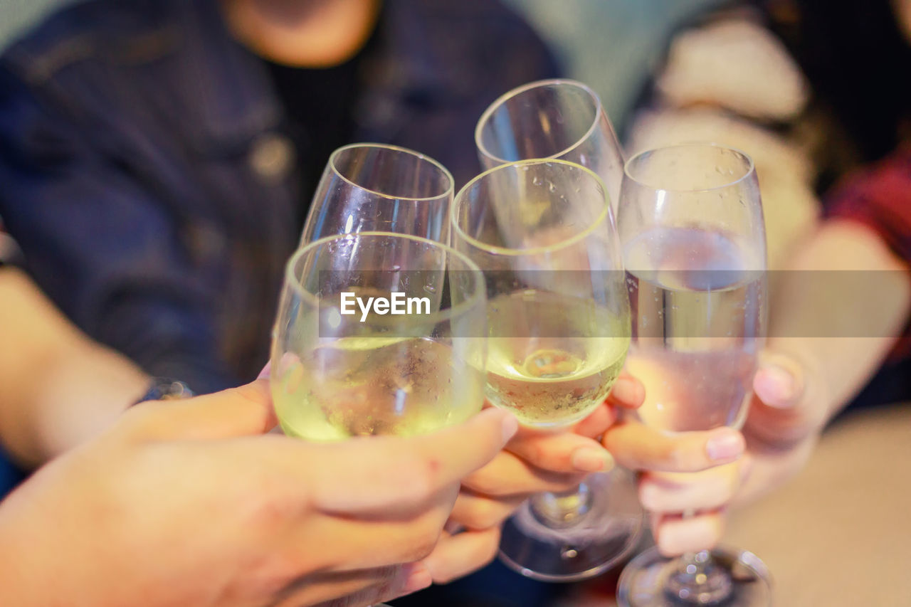 Close-up of hand holding wine glasses