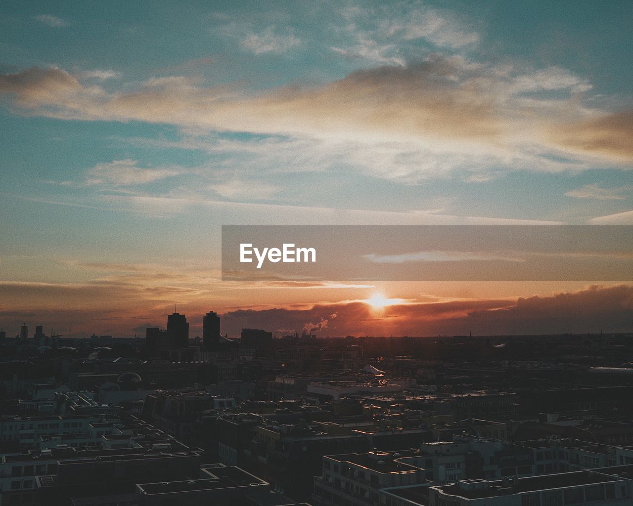 High angle view of cityscape against sky during sunset