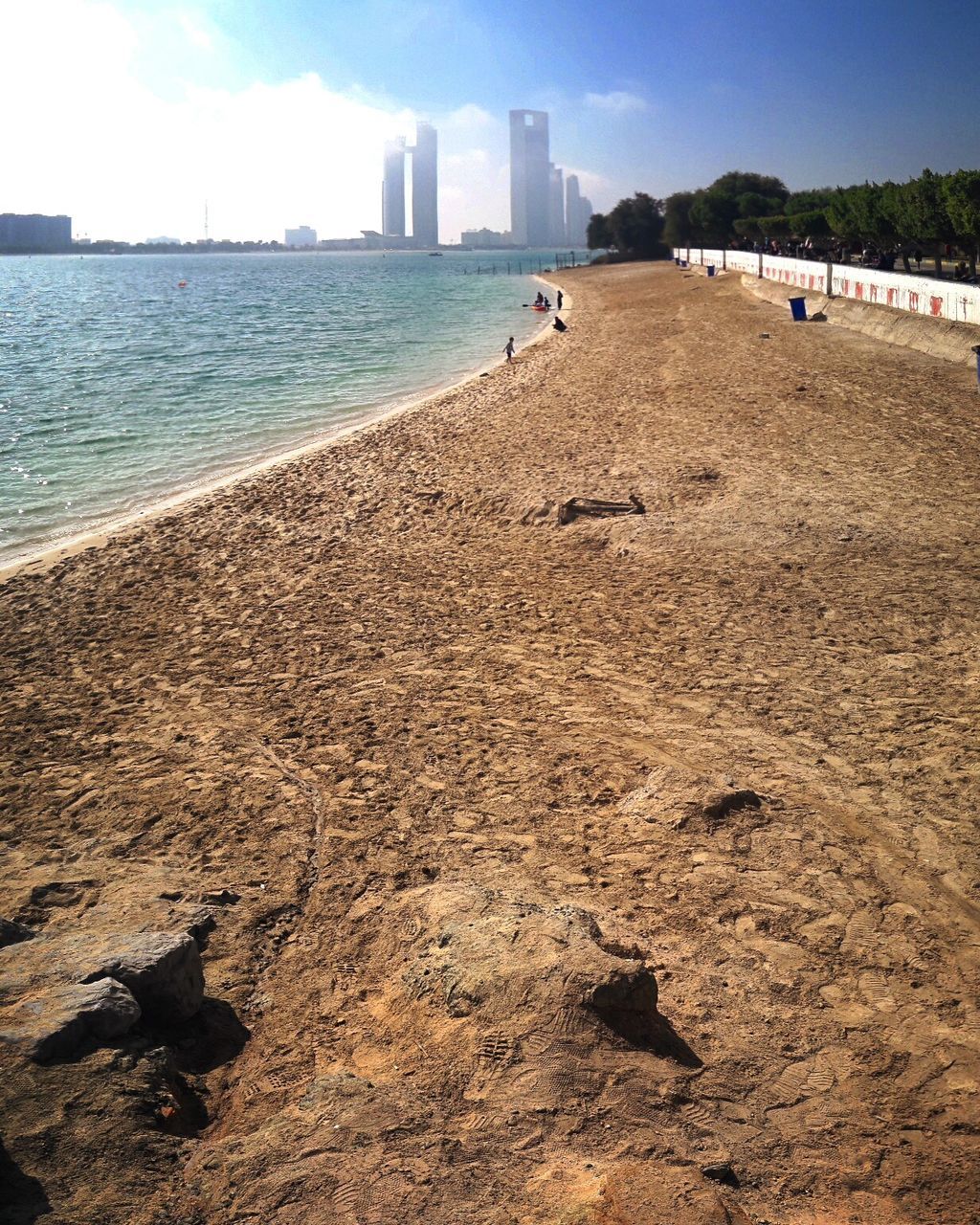 SCENIC VIEW OF BEACH AND CITY AGAINST SKY