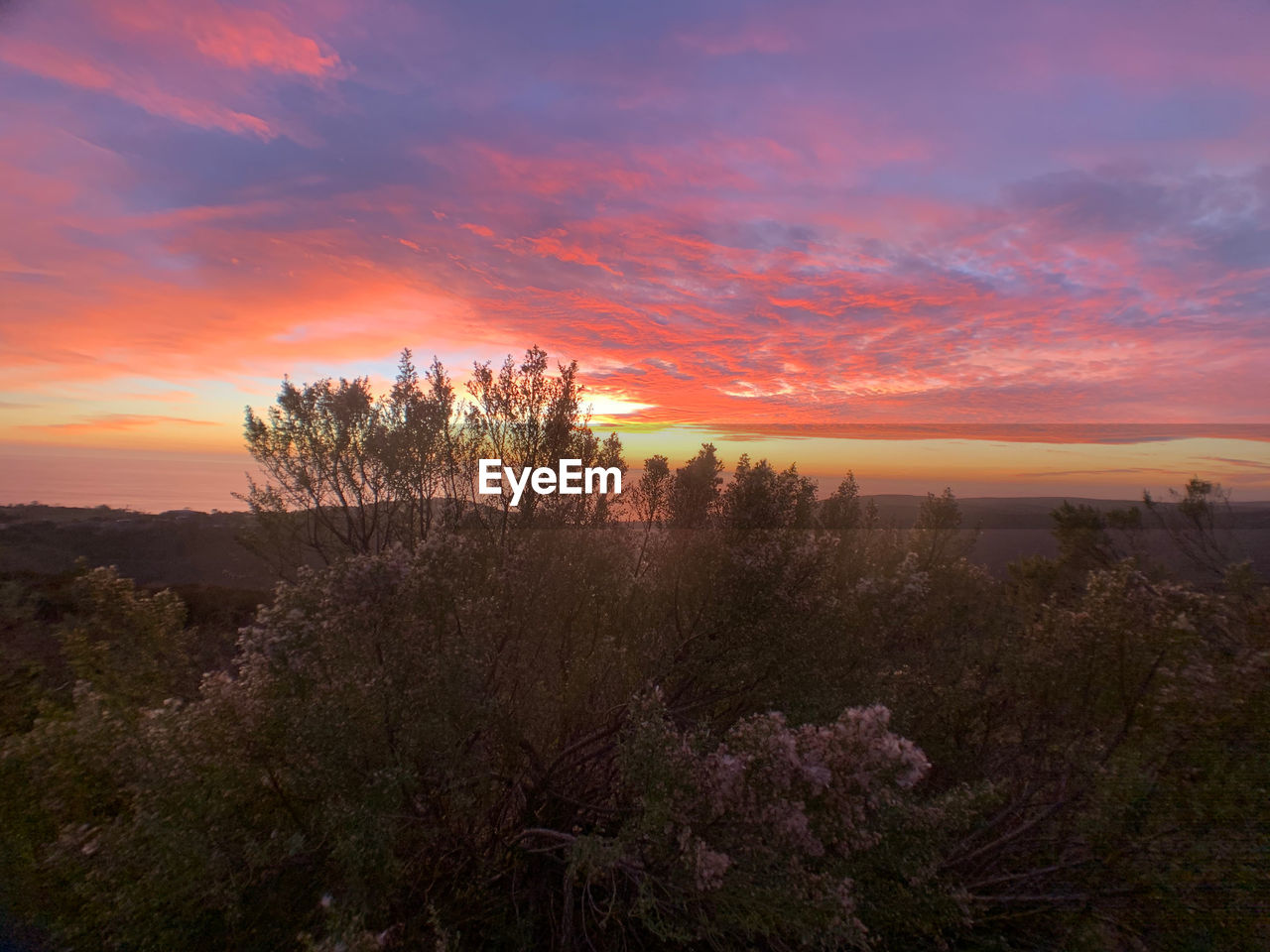 Scenic view of dramatic sky during sunset