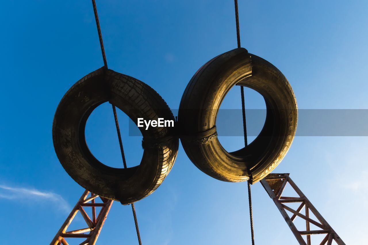 Low angle view of metallic structure against sky